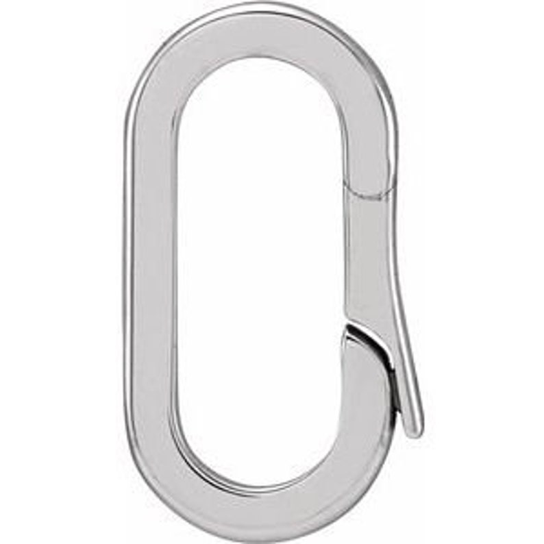 May include: A polished, silver-colored oval carabiner clip. The clip has a smooth, reflective surface and a spring-loaded gate for secure closure. The design is minimalist and modern, suitable for various uses.