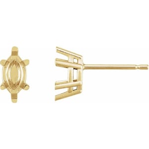 May include: A pair of gold earring settings for marquise shaped gemstones. The settings are prong set and have a post back.