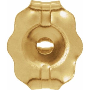 May include: Gold-toned earring back with a scalloped edge and a round hole in the centre.