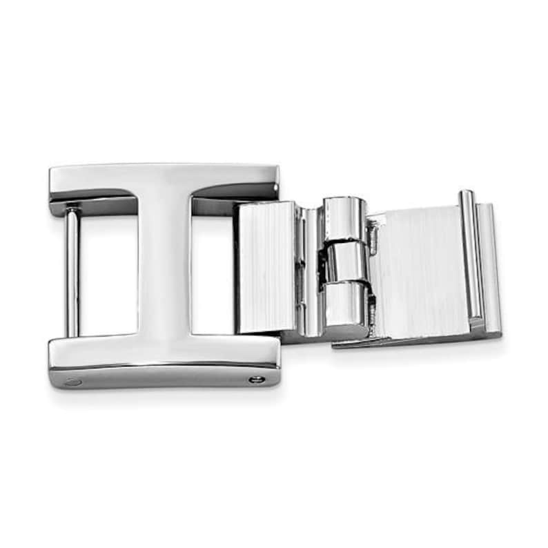 May include: A shiny, silver-colored metal clasp with an 'I' shape on one end and a hinged, rectangular section on the other. The clasp is designed with a polished finish, reflecting light and showcasing its geometric design. The overall aesthetic is modern and minimalist.