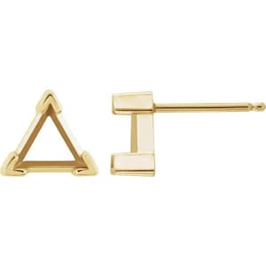 May include: A pair of gold triangle earring settings. The settings are designed to hold a gemstone or other embellishment.