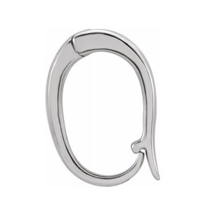 May include: A polished, silver-toned earring clasp. The clasp is oval-shaped with a curved design and a hook closure. The metal has a reflective surface, and the design is simple and elegant. The earring clasp is shown against a white background.