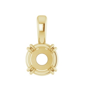May include: A gold pendant setting with a round bezel and four prongs. The pendant has a bail for attaching a chain.