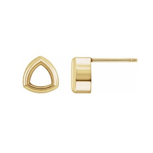 May include: A pair of gold triangle stud earrings with a hollow center.
