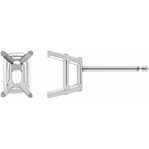 May include: A pair of silver earring settings for an emerald cut gemstone. The settings are designed to hold the gemstone securely in place.