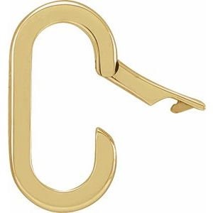 May include: A gold-colored, oval-shaped carabiner clip with a hinged lever. The clip is designed with a simple, modern aesthetic, and the lever is open. The carabiner is likely made of metal.