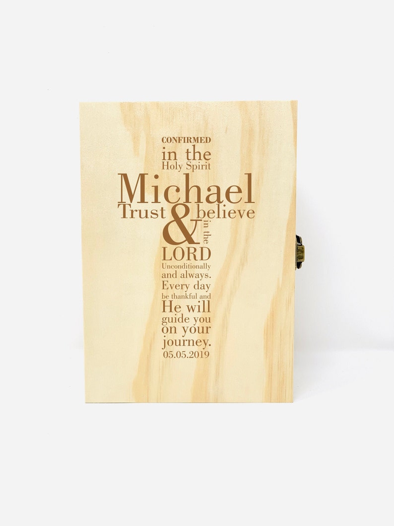 May include: A wooden box with a brown inscription that reads "CONFIRMED in the Holy Spirit Michael Trust & believe in the LORD Unconditionally and always. Every day be thankful and He will guide you on your journey. 05.05.2019"