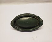 Antique Iron door knocker in old green paint