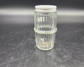Hoosier style ribbed spice jar without holes in aluminum top. Tops are in very good shape for age. See pictures price is for each.