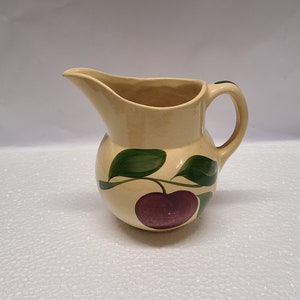 Watt apple pottery pitcher 5 3/4&quot;. A lot of staining and crazing inside.