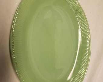 Fire king Jade-ite Jane ray Oval platter 12 inch. These both have a very faint logo on the back.