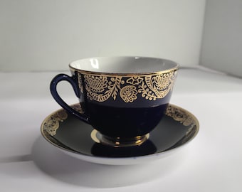 Lomonosov  cobalt blue USSR Tea cup and saucer. 2.75 inches tall by 3.75 inches in diameter.