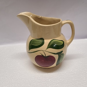 Watt apple pottery pitcher 6 1/2 inch. A lot of staining and crazing inside and outside.