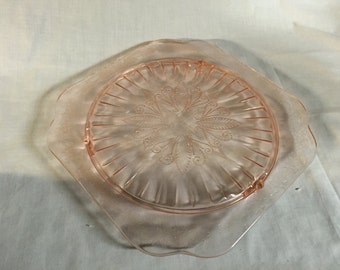 Pink adam depression glass Cake plate. 9 3/4" with 3 short feet.