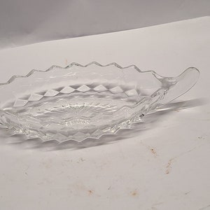 American Fostoria 2 handled dish 9 inches long 3 1/2 inch wide
