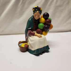 Figurine de vendeur de ballons anciens Royal Doulton