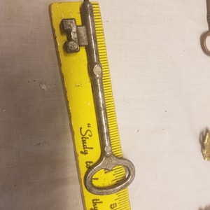 Vintage Aluminum Suburban Toys key #12