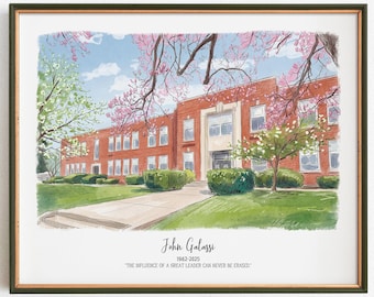 May include: Watercolor print of a brick building with a white entrance, framed in a dark green frame. The building is surrounded by green grass, bushes, and trees with pink and white blossoms. The text "John Galassi 1962-2025" and a quote are below the building.