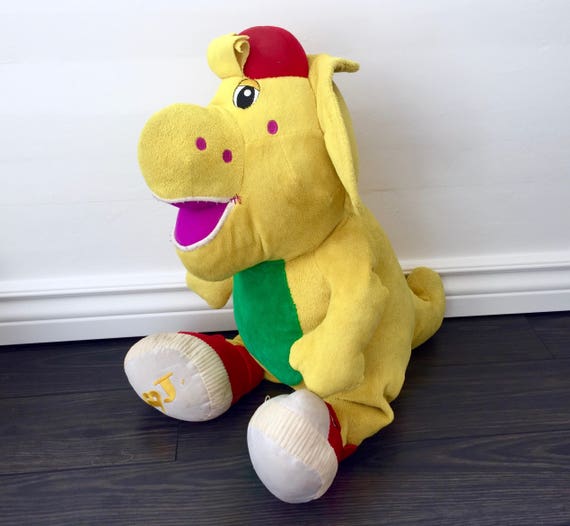 yellow stuffed dinosaur