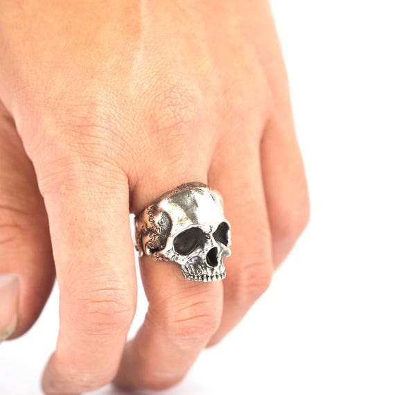 Half skull best sale ring
