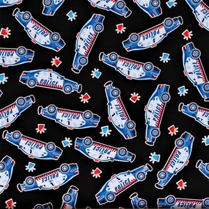 May include: Black fabric with a repeating pattern of blue and white police cars with the word "POLICE" printed on them. The cars are surrounded by red and blue stars.