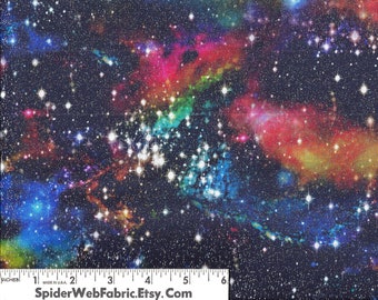 May include: A dark blue fabric with a colorful galaxy print. The print features a variety of colors, including red, orange, yellow, green, blue, and purple. The fabric is covered in small white stars.