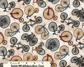 May include: A fabric pattern featuring various vintage-style bicycles and penny-farthings in red, blue, and black on a beige background, with a white ruler at the bottom showing 6 inches for scale and the text SpiderWebFabric.Etsy.Com.