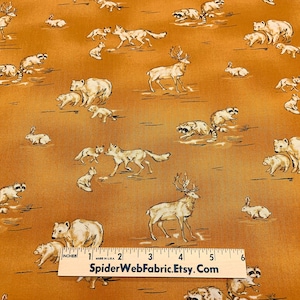 May include: A brown fabric with a white print of various woodland animals, including deer, foxes, bears, raccoons, and rabbits. The fabric is measured with a ruler that reads "SpiderWebFabric.Etsy.Com".