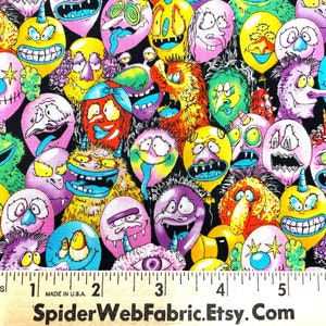 May include: A black fabric with a repeating pattern of colorful cartoon faces. The faces are all different and have various expressions. The fabric is printed with the text "SpiderWebFabric.Etsy.Com".