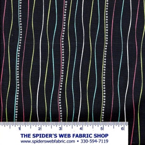 May include: Black fabric with a repeating pattern of wavy lines in white, light blue, light green, and pink. The lines are accented with small white circles.