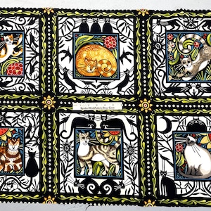 May include: Fabric panel featuring six square illustrations of cats in various poses, framed by black and white decorative borders. The cats are depicted in a colorful, artistic style, with accents of red, yellow, and green. The background is black.