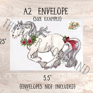 May include: A2 envelope with a watercolor illustration of a white horse with a gray mane and tail, adorned with a Christmas wreath and a red plaid bow. The envelope measures 4.25 x 5.5 inches.