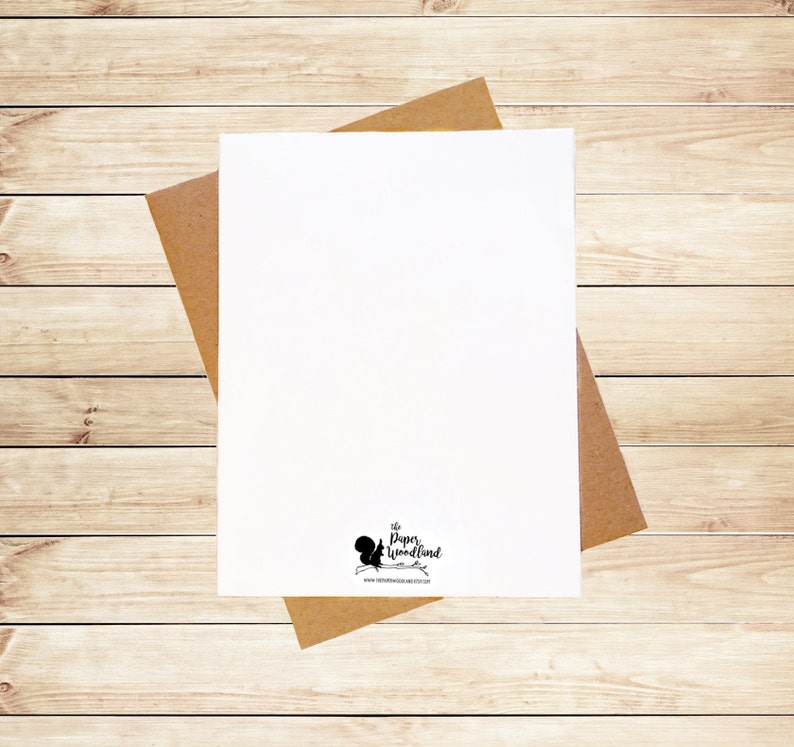May include: A blank white card with a brown envelope. The card has a small black squirrel logo with the text "The Paper Woodland" and a website address.