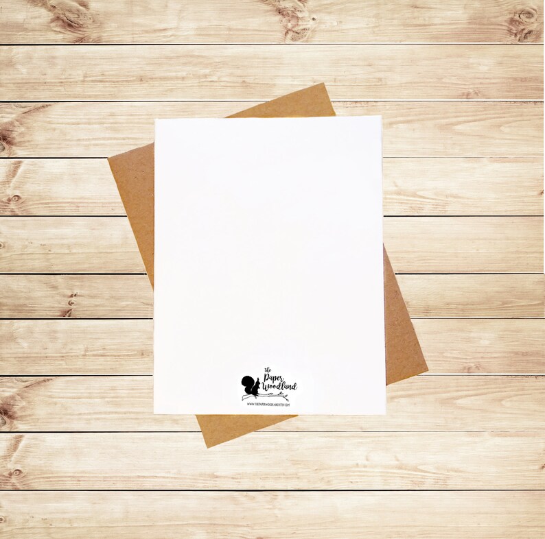 May include: A blank white card with a brown envelope. The card has a small black squirrel logo with the text "The Paper Woodland" and a website address.