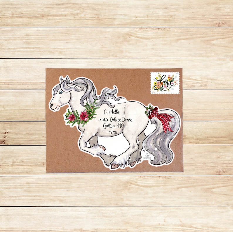 May include: A watercolor illustration of a white horse with a flowing gray mane and tail, adorned with a floral wreath and a red plaid bow. The horse is on a brown envelope with a floral "Love" stamp and address details.