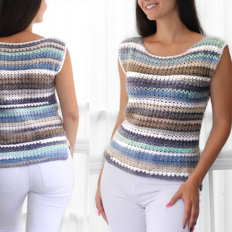 May include: A striped crochet top with a scoop neck and sleeveless design. The top is made with a variety of colors, including blue, white, brown, and gray.