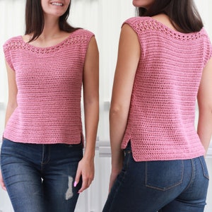 May include: A sleeveless crochet top in a light pink color. The top has a delicate crochet trim around the neckline and armholes. The top is shown on a model wearing blue jeans.