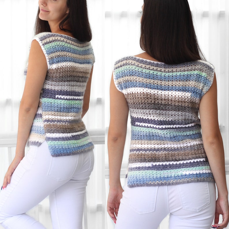 May include: A sleeveless crochet top with a striped pattern in shades of blue, green, white, and brown. The top has a boat neck and a relaxed fit.