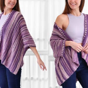 May include: A purple and pink striped crochet cardigan with a loose fit and a scalloped edge.