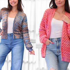 May include: Two open-front crochet cardigans. One is a mix of blue, brown, and beige, the other is pink with ombre shades. Both have long sleeves and are worn over white tops and blue jeans. The cardigans have a textured, open weave.