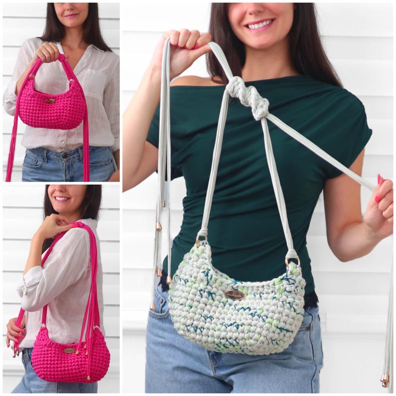 May include: A crescent-shaped crochet handbag featuring a textured knit pattern, a long adjustable strap with a knotted detail, and a small metallic logo plate. The bag is available in a solid vibrant pink or a speckled white and green colorway.