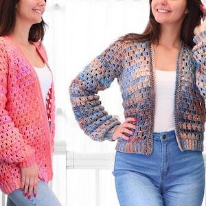 May include: Two open-front crochet cardigans. One is a gradient of pink and orange hues, the other features blue, brown, and beige tones. Both have long sleeves and a loose, open weave design, suitable for layering.