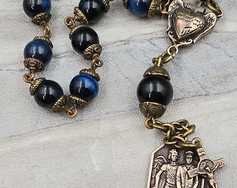 Protezione della Polizia, Rosario Michael Benedict / Bronzo/Occhio di Tigre Blu