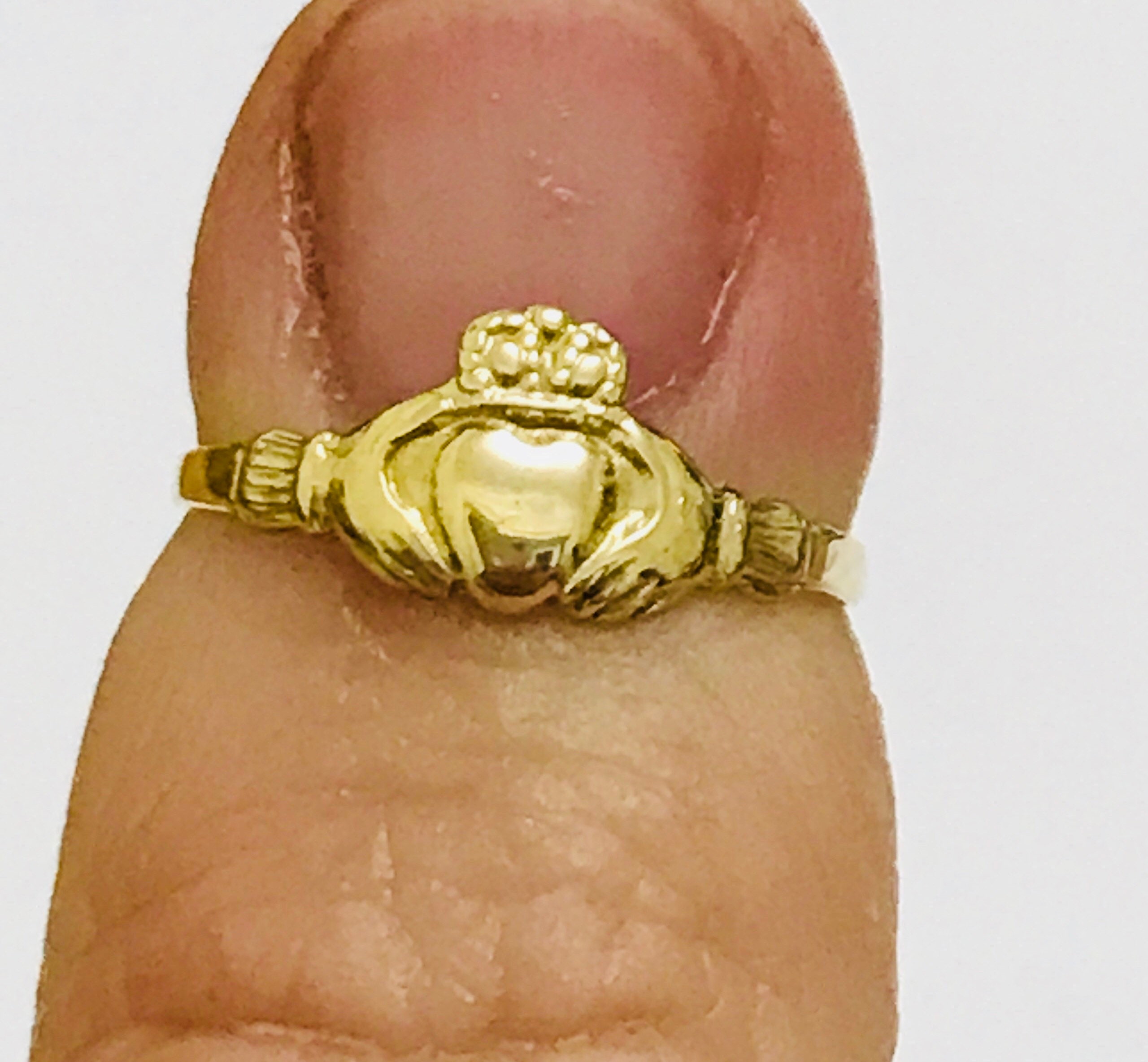 Small child deals gold ring