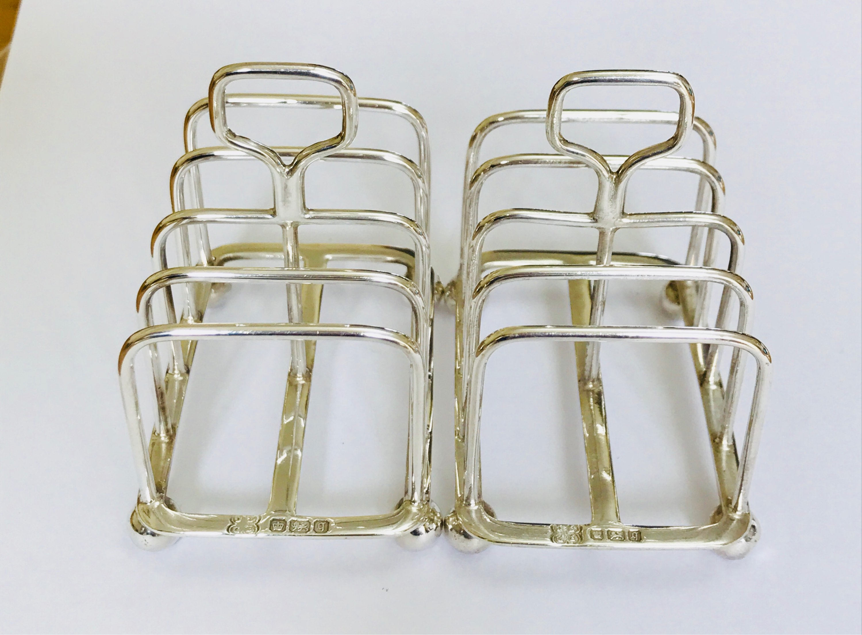 Superb matching pair of antique Edwardian sterling silver toast ...