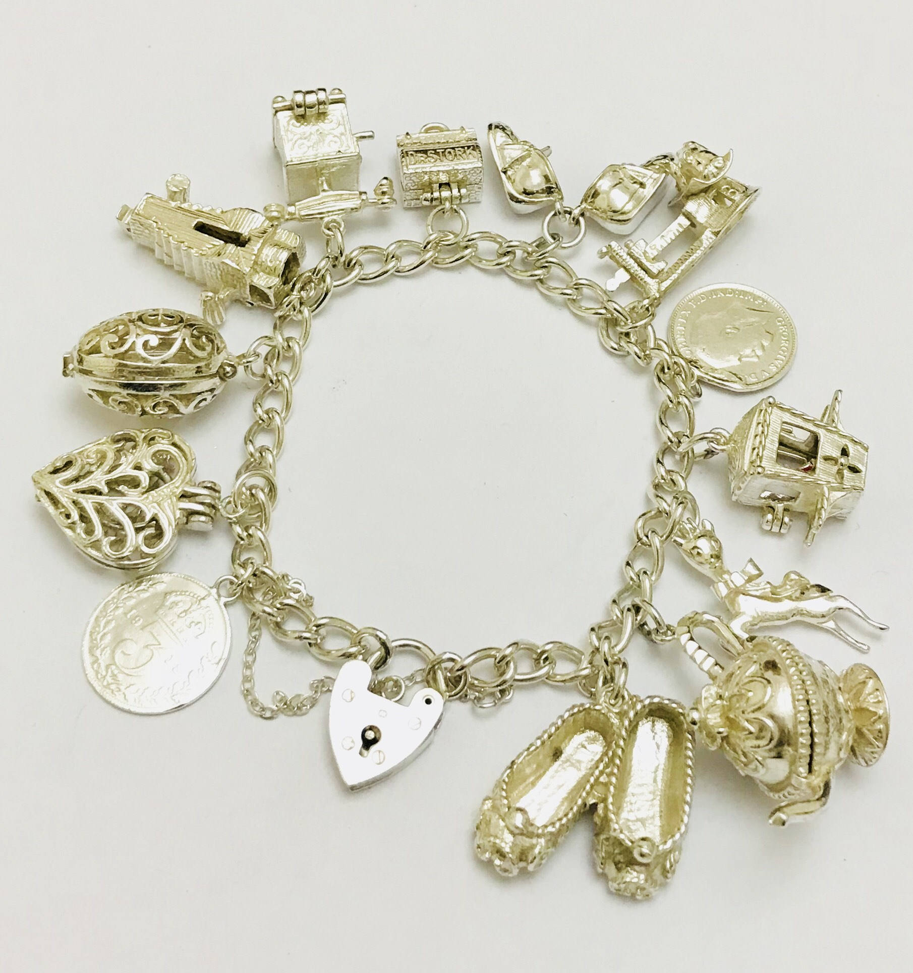 Stunning vintage sterling silver charm bracelet with unusual