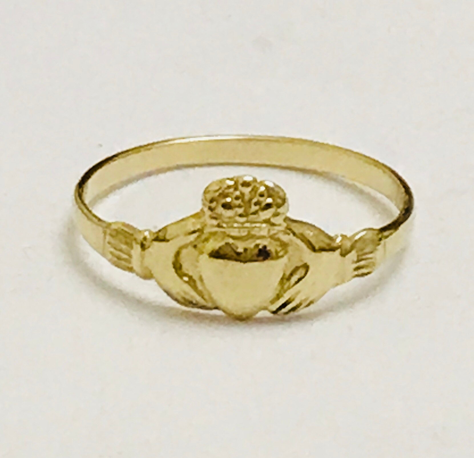 Small child deals gold ring