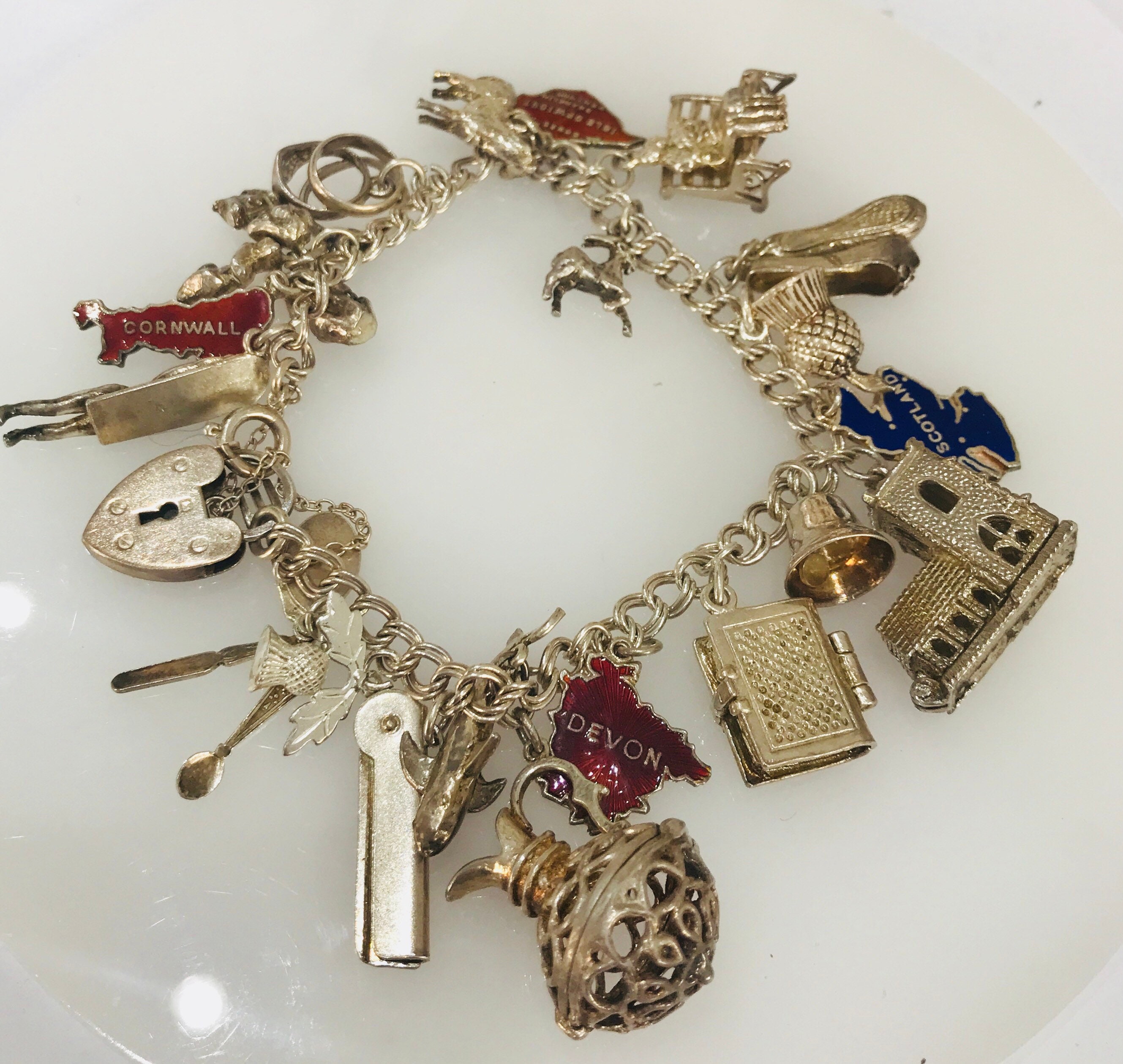 Vintage sterling silver charm bracelet with 20 charms hallmarked London 1965 Vintage sterling silver charm bracelet with 20 charms hallmarked London 1965