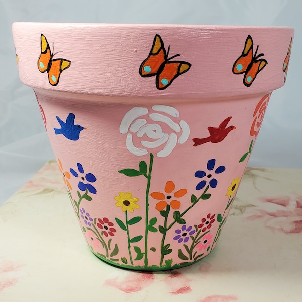 Hand Painted Pink Floral 4x6 Terra Cotta Flower Pot. Trimmed at the rim with colorful Butterflies.