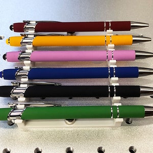 Pen / Pencil Jig for Fiber Laser Engraving. 3D printed from PETG plastic. Holds 6 pieces